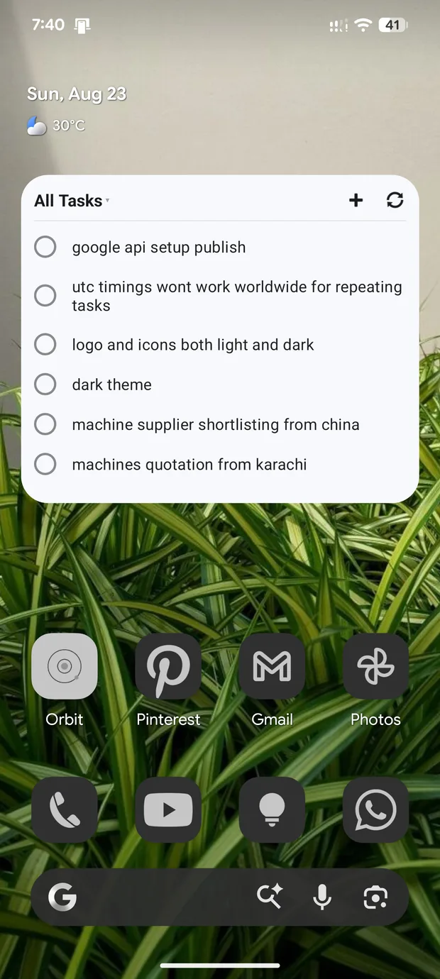 The Orbit widget on an Android home screen, listing tasks with tick boxes above the app icons.